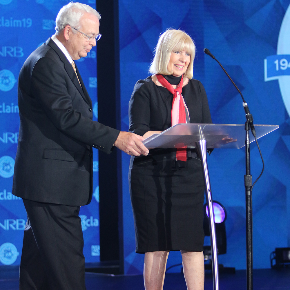 Darlene Ankerberg accepting Award on behalf of John Ankerberg